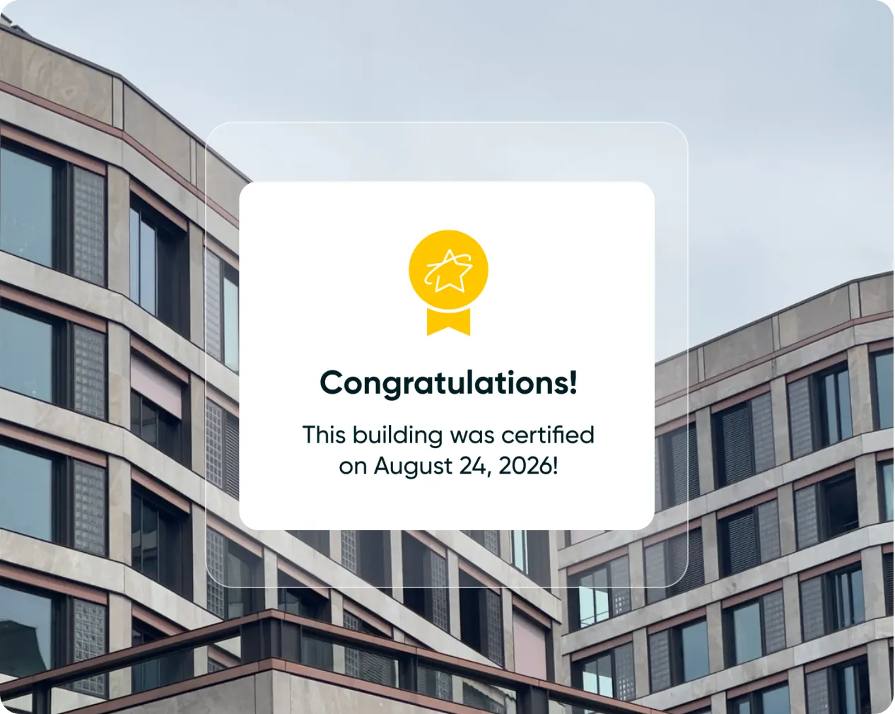 A certification notice over an office building: “Congratulations! This building was certified on August 24, 2026”